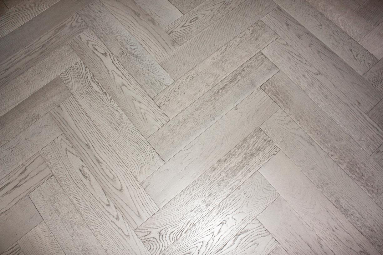 Istoria Bespoke Fossil Engineered Herringbone Wood Flooring by Jordan Andrews